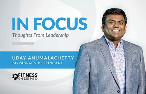 A man in a gray blazer smiles next to text that reads: IN FOCUS Thoughts From Leadership. Uday Anumalachetty, Divisional Vice President. Fitness On Demand.
