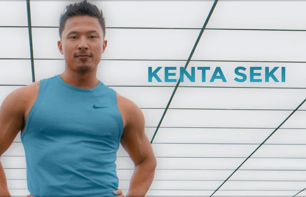 A man wearing a blue sleeveless athletic shirt stands confidently with his hands on his hips. The text KENTA SEKI appears next to him against a modern, white, grid-patterned background.