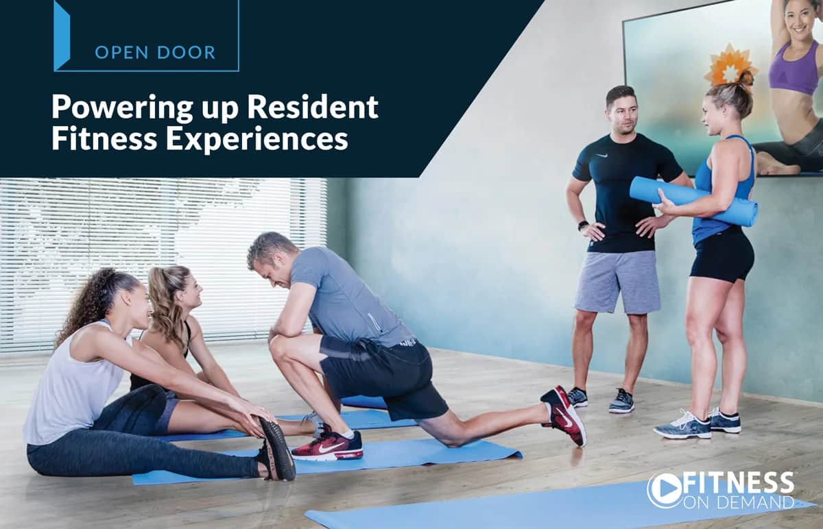 Four people in athletic wear are stretching on exercise mats in a bright, modern room, while a man and woman stand nearby holding yoga mats. A screen displays a virtual instructor. Text reads “Powering up Resident Fitness Experiences.”.