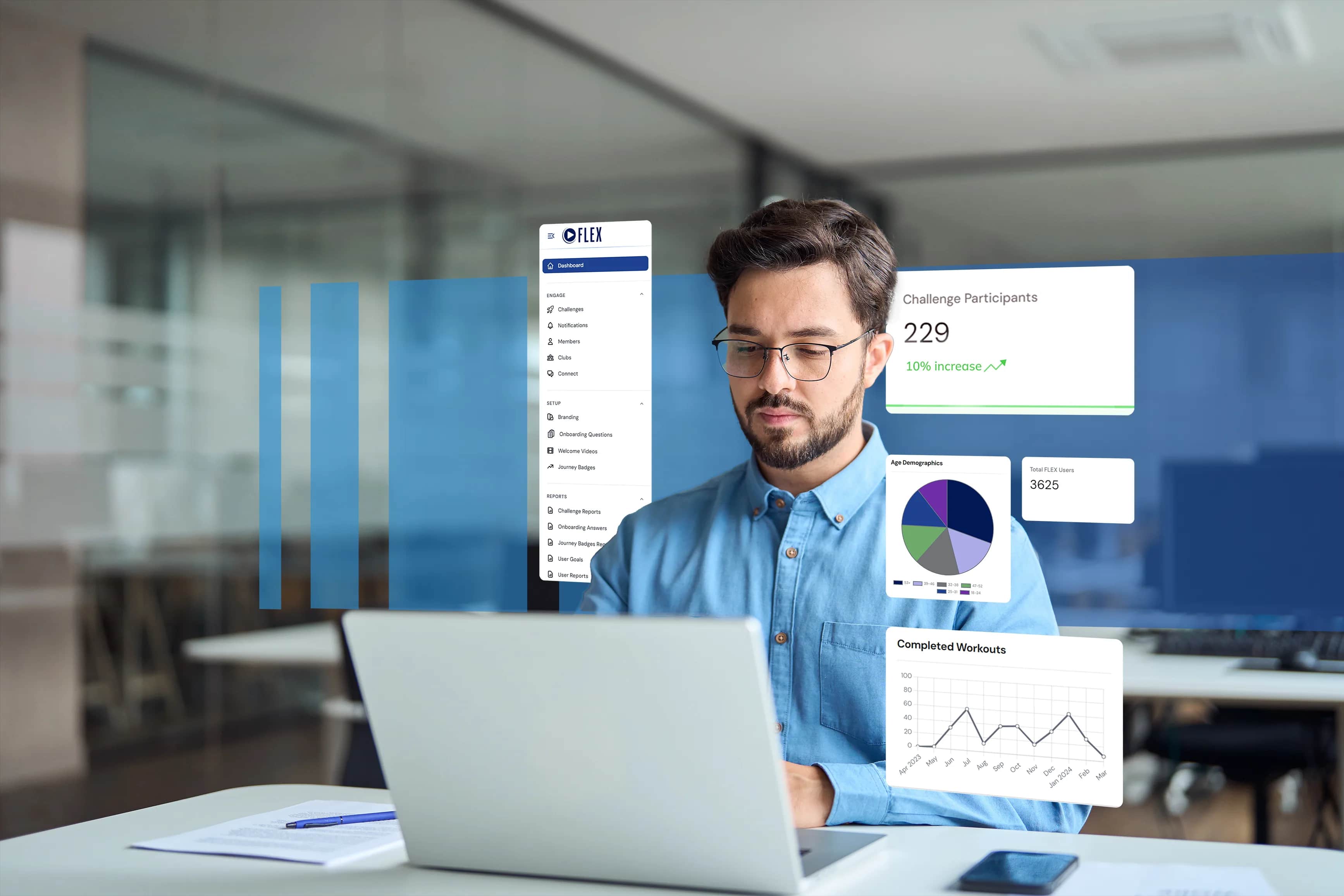 A man wearing glasses and a blue shirt works on a laptop in a modern office, with floating digital graphs and charts displaying data and statistics around him.