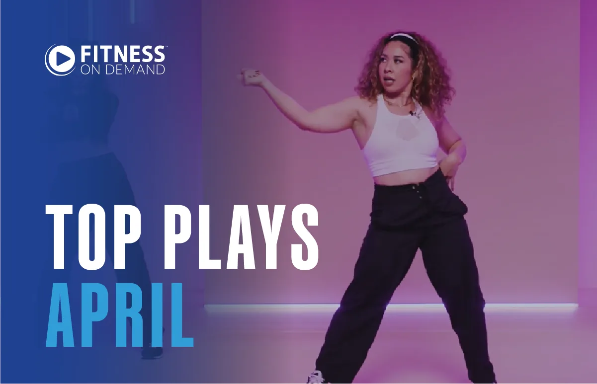 A woman in workout clothes dances energetically against a purple-pink background. Text reads Fitness On Demand and Top Plays April.