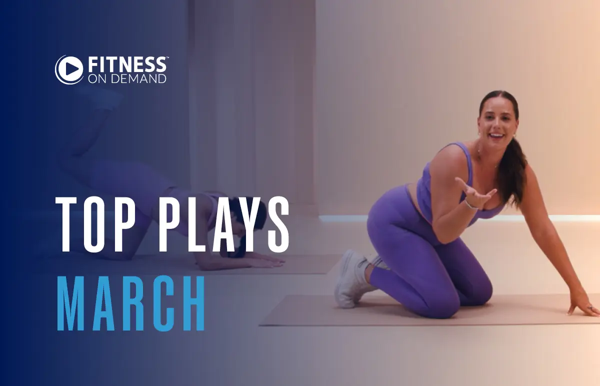 A woman in a purple workout outfit kneels on an exercise mat, smiling and gesturing, with Fitness On Demand and Top Plays March text overlaid on the image.