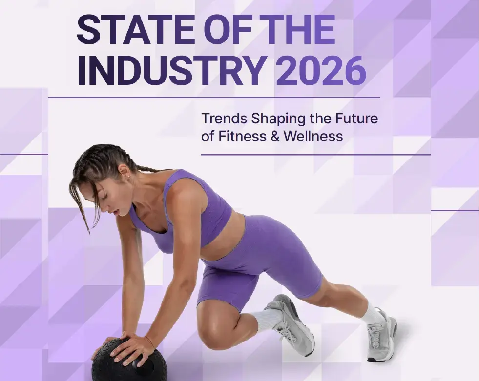 A woman in a purple workout outfit exercises with a black medicine ball on the floor. Text reads: State of the Industry 2026. Trends Shaping the Future of Fitness & Wellness.