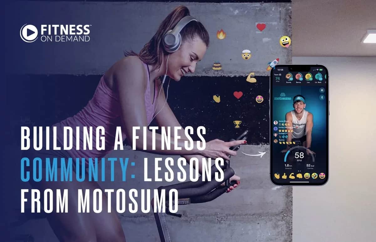 A woman on a stationary bike smiles while using her phone, wearing headphones. Next to her is a smartphone displaying a fitness app with live video, emojis, and interaction icons. Text reads: Building a Fitness Community: Lessons from Motosumo.