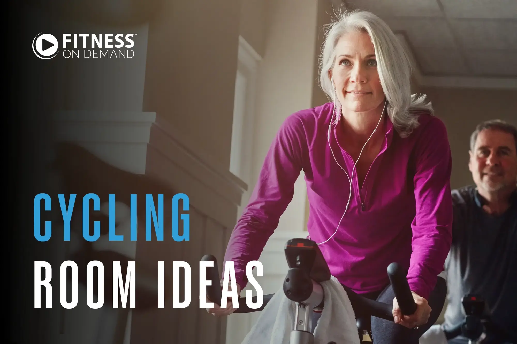 A smiling woman in a magenta top rides a stationary bike indoors, wearing earphones. A man in the background also cycles. The text reads “Fitness On Demand. Cycling Room Ideas.”.