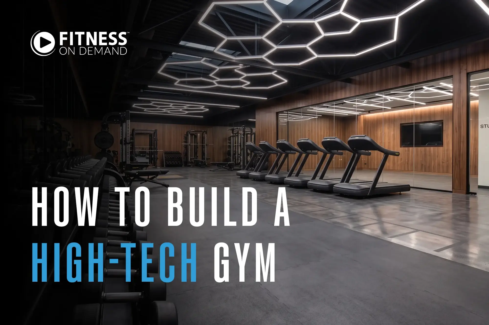 A modern gym with treadmills, free weights, wooden walls, and futuristic hexagonal ceiling lights. Text reads: How to Build a High-Tech Gym. Fitness On Demand.