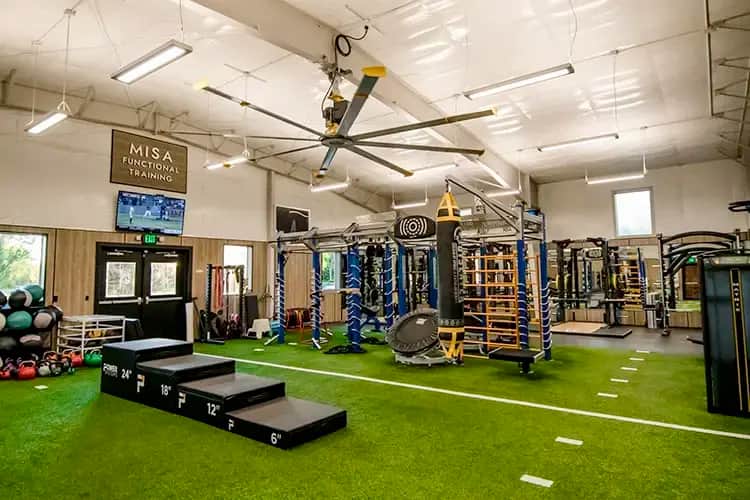 The gym floor at the Montana Athletic Club. Astroturf, gym equipment, and omnichannel fitness solutions.