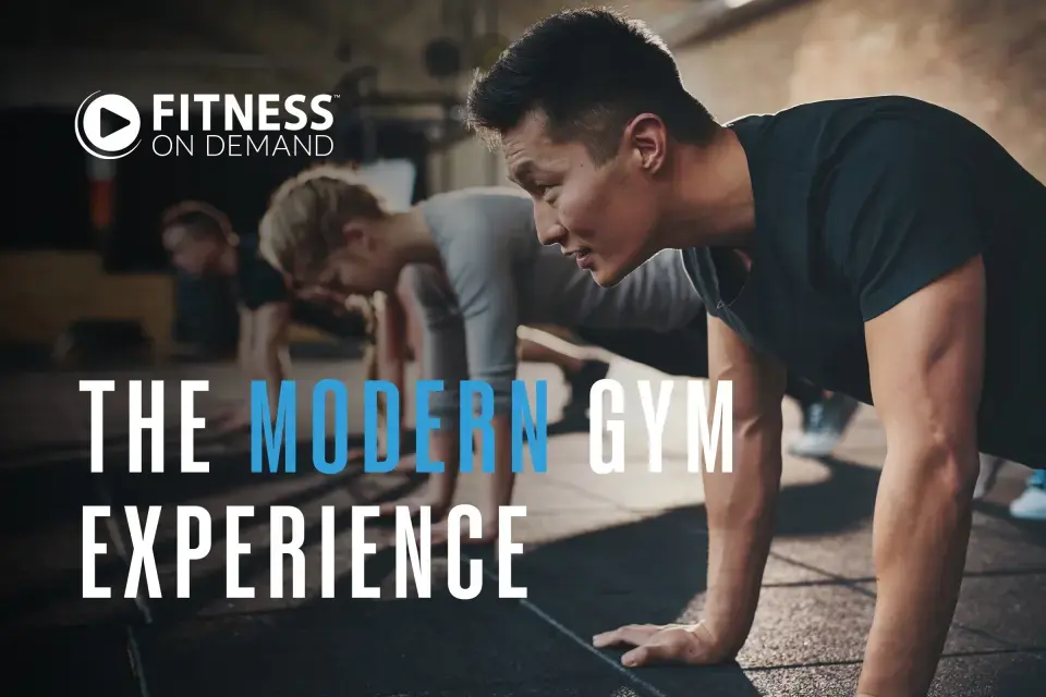 A group of people doing push-ups in a gym. Text reads: “Fitness On Demand: The Modern Gym Experience."