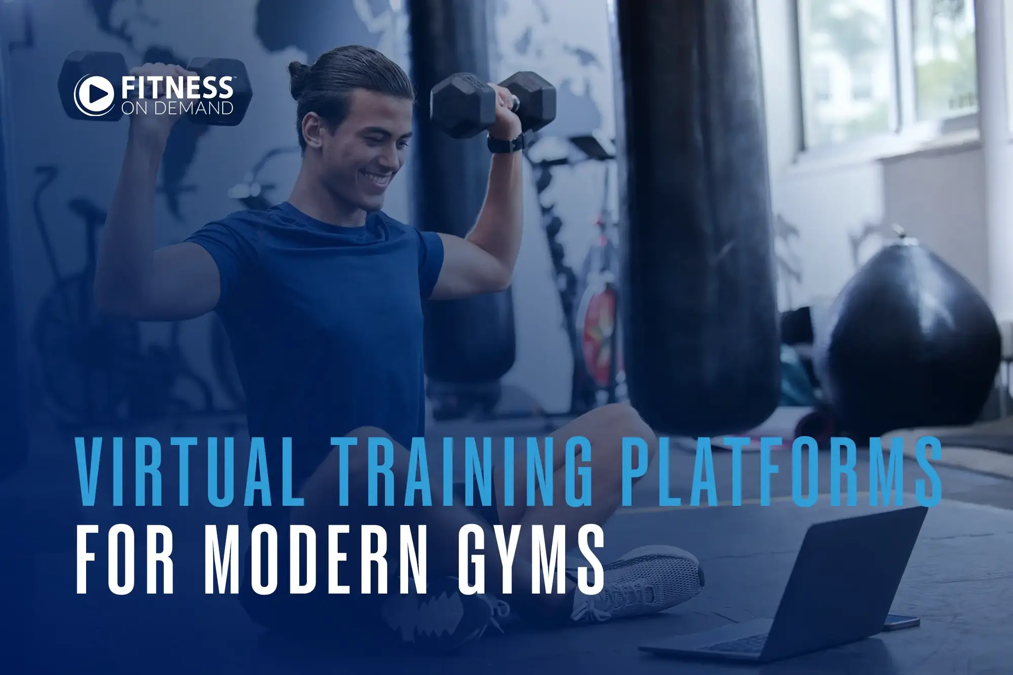 A man in workout clothes lifts dumbbells while sitting on a gym floor, watching a laptop. Text reads: Virtual Training Platforms for Modern Gyms.
